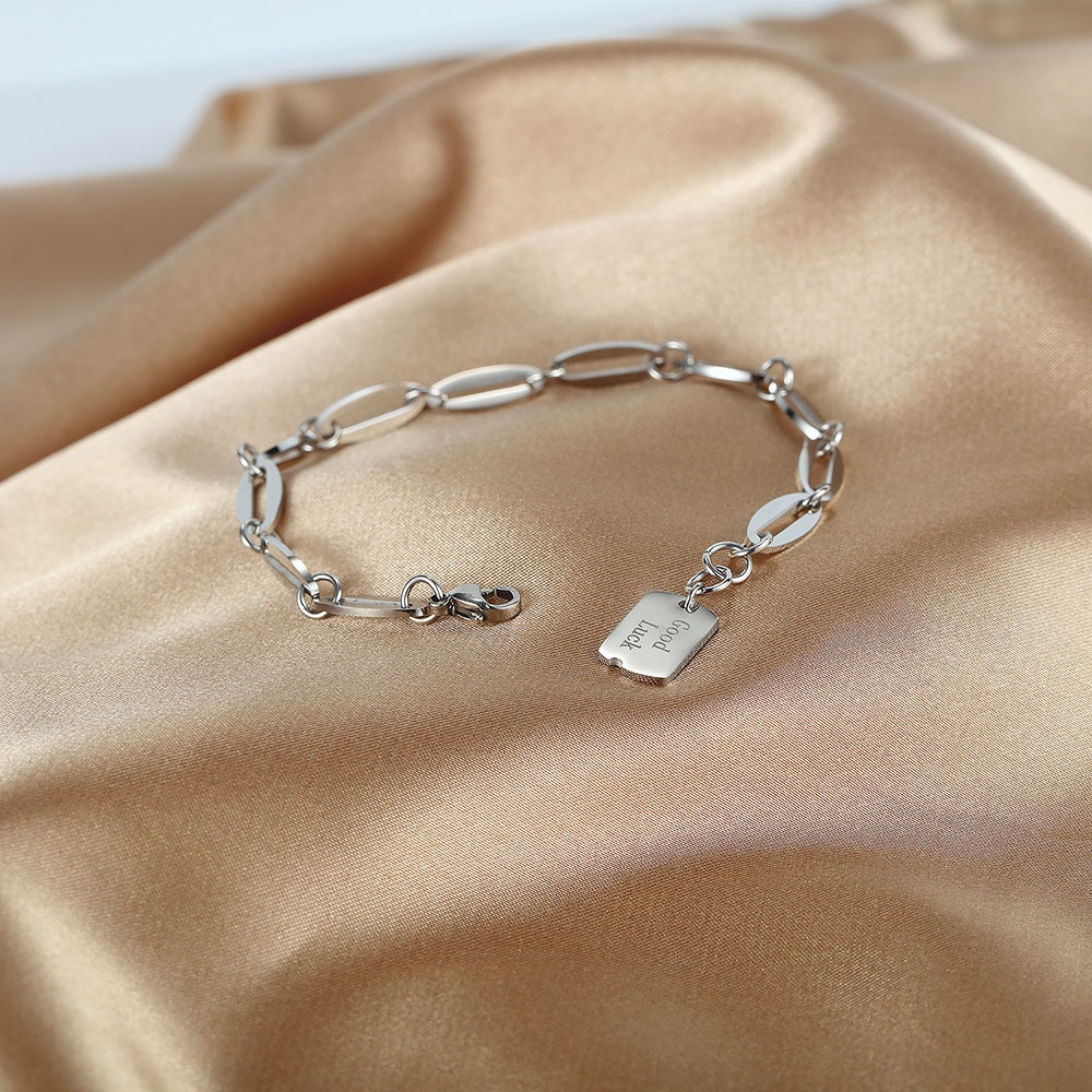 Women's Stainless Steel Bracelet with Good Luck Engraved Pendant Women's Stainless Steel Bracelet with Good Luck Engraved Pendant